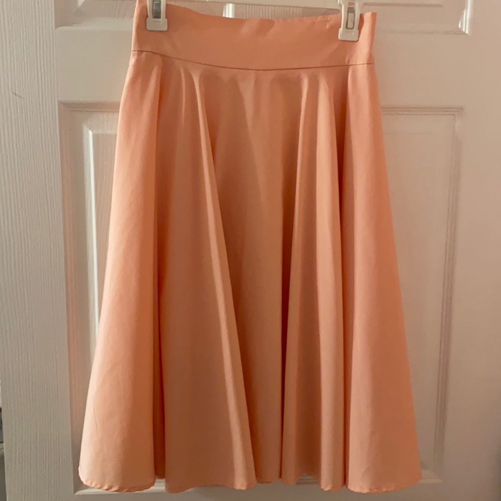 Worn twice. Soft pink skirt.